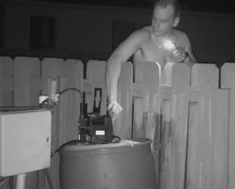 Second photo of person switching off rust proofing motor